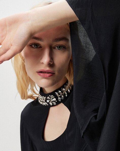 Choker mania. A studio portrait of a young charming lady wearing a black  cord choker necklace