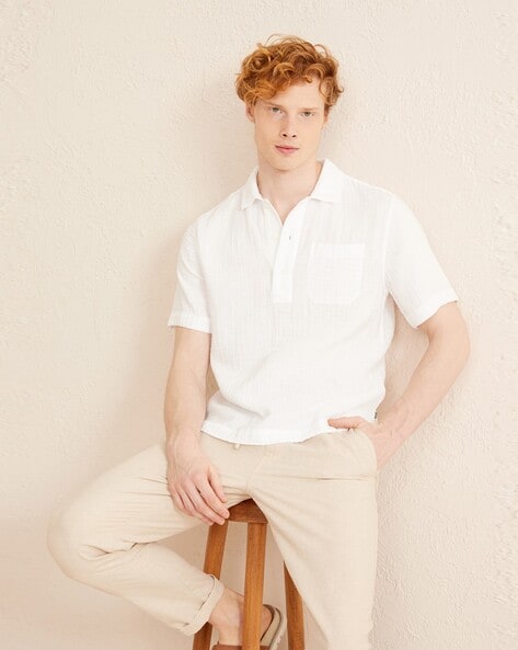 CloseUp Shot of a Man in White Polo Shirt and Khaki Pants  Free Stock  Photo