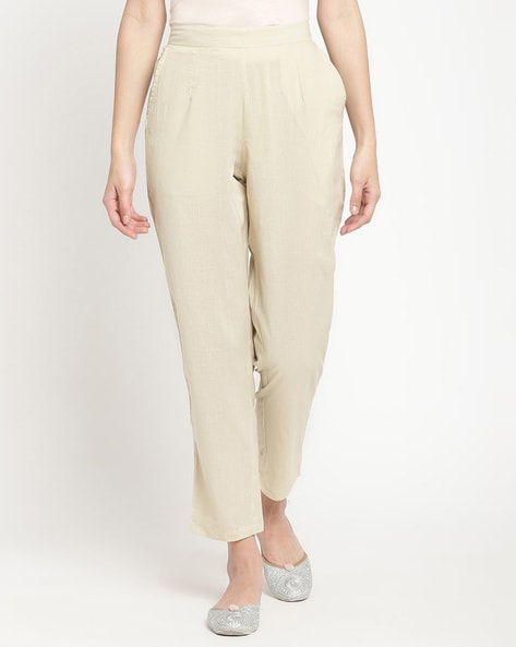 Off-white low waisted pleated cuffed Cigarette Pants | Sumissura
