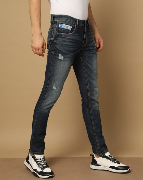 Buy Men Light Blue Cotton Slim Fit Mild Ripped Mid Rise Jeans