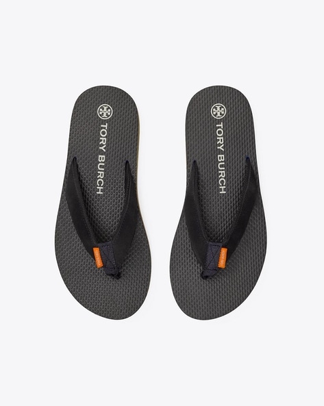 Tory burch black best sale and white flip flops