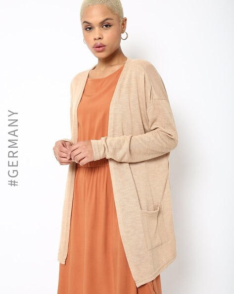 Beige cardigan with outlet pockets