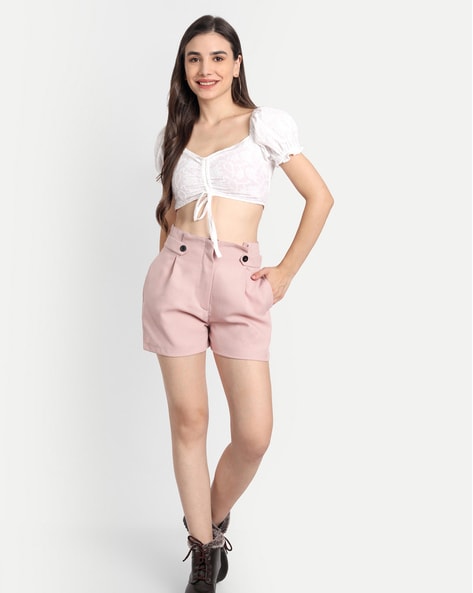 body shot of a young woman wearing hot pants and a crop top Stock Photo |  Adobe Stock