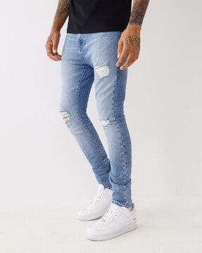Mild top distress jeans