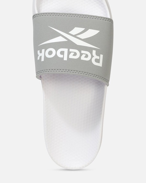 White reebok online slides