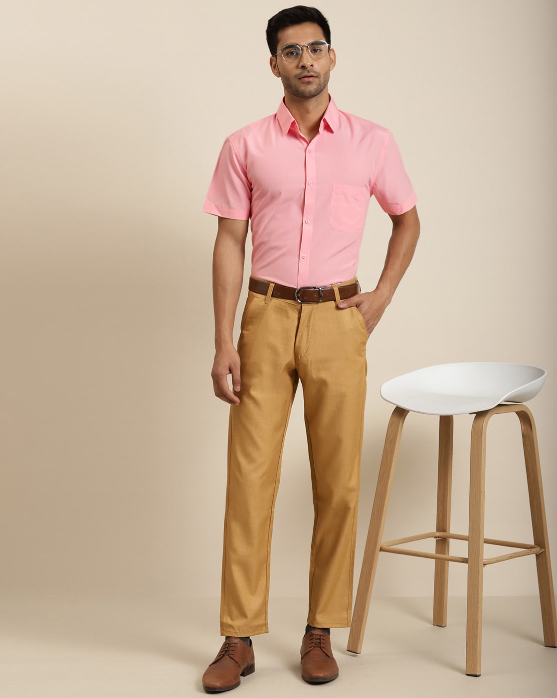 Full length body size portrait of man wearing bowtie suspenders brown pants  keeping hands in pockets isolated on pink color background Stock Photo by  ©deagreez1 427735418