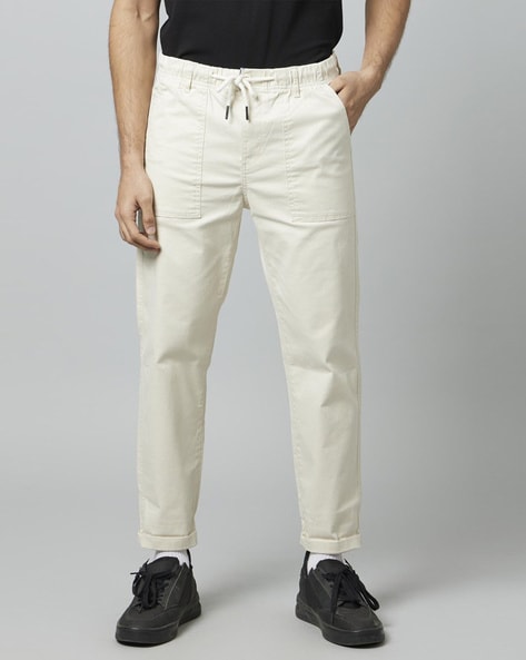 Buy CELIO Camel Mens Slim Fit Solid Trousers | Shoppers Stop