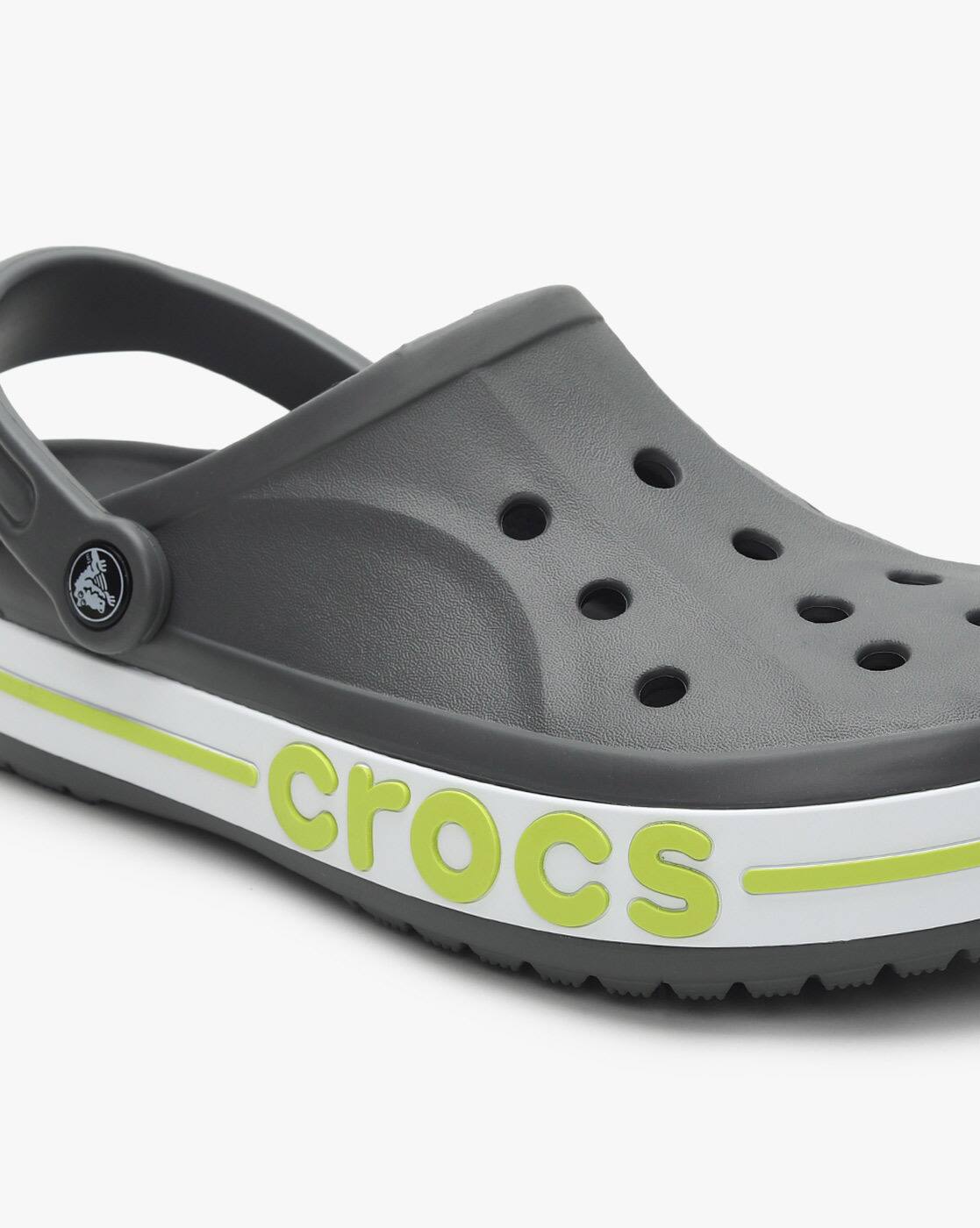 grey and green crocs