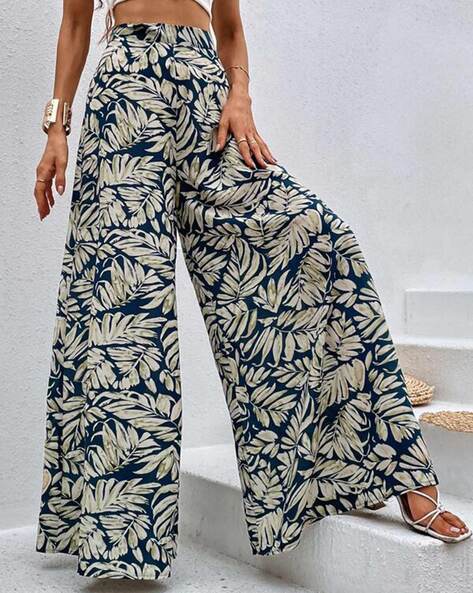 White leaf print stretch trousers with pleats, pockets and belt