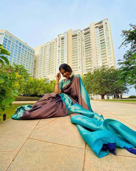 Beautiful Indian young girl in Traditional Saree posing outdoors 4976615  Stock Photo at Vecteezy