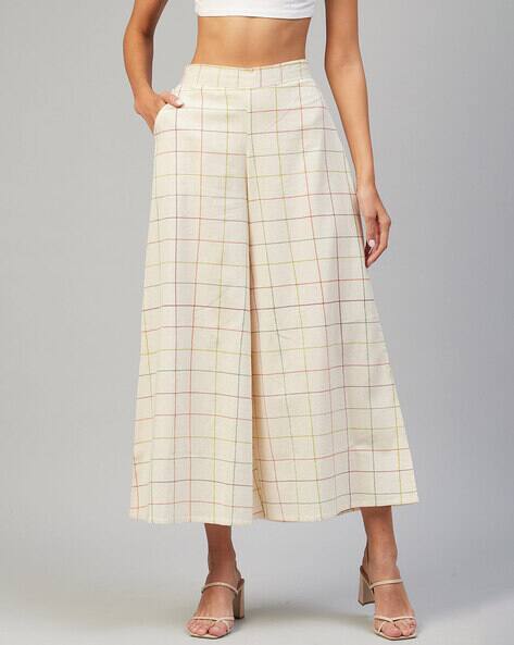 Buy Cream Trousers Pants for Women by VAABASTA Online