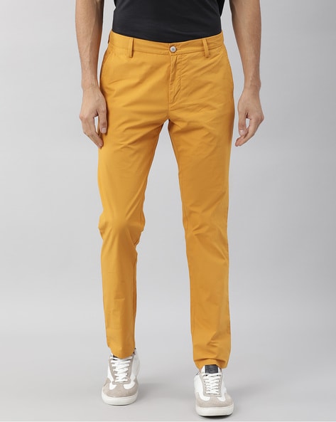 Mustard Yellow Stretch Washed Chinos Trouser at best price in Gurugram