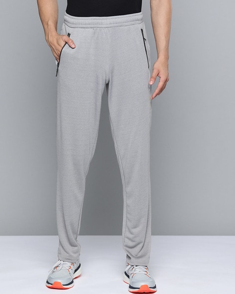 Mens Lycra Slim Fit Track Pants with 2 Side Zipper Pockets and Logo at  Best Price in India  Healthkartcom