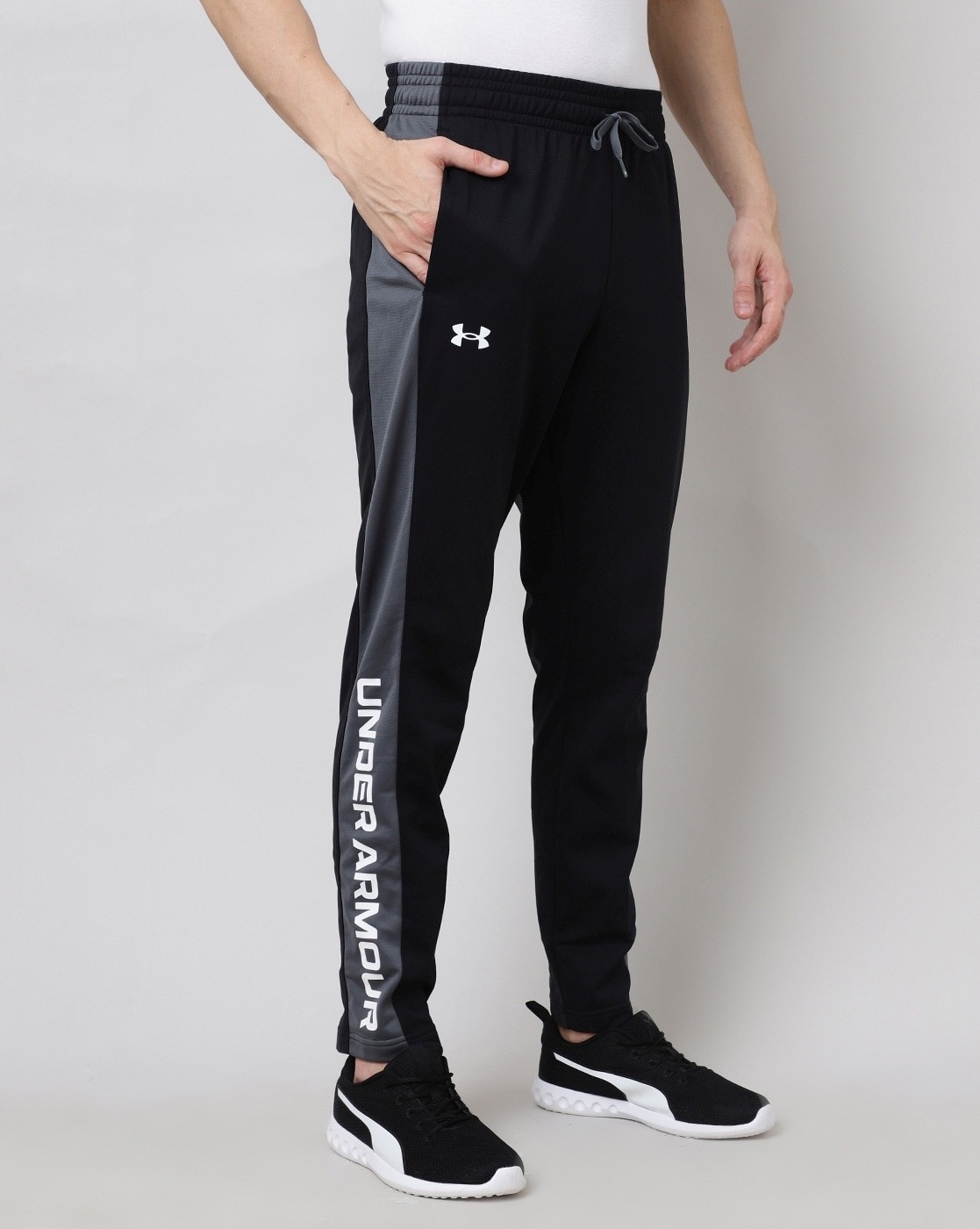 UNDER ARMOUR Solid Men Black Track Pants Buy Black, High Vis Yellow UNDER  ARMOUR Solid Men Black Track Pants Online At Best Prices In India