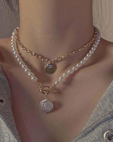 Tiffany Victoria® pendant in platinum with a South Sea pearl and diamonds.  | Tiffany & Co.