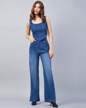 https://assets.ajio.com/medias/sys_master/root/20230622/QvFx/64947670d55b7d0c63a1f022/orchid_blues_blue_denim_top_with_flared_jeans.jpg