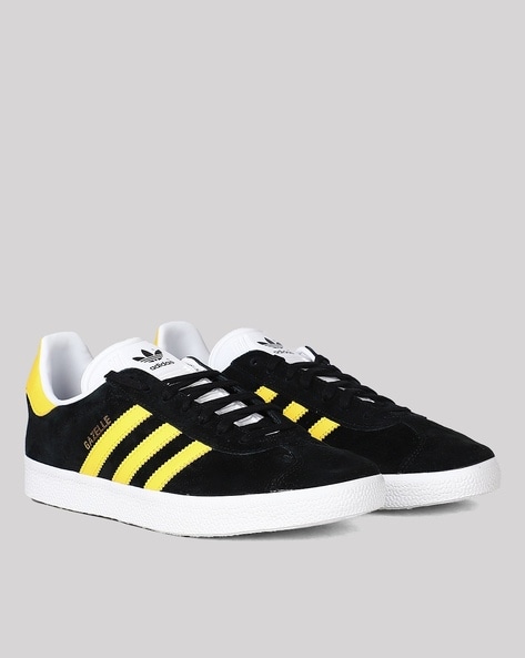 Adidas black clearance and yellow shoes