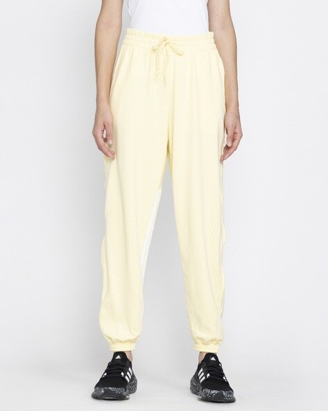 Yellow adidas store track pants womens