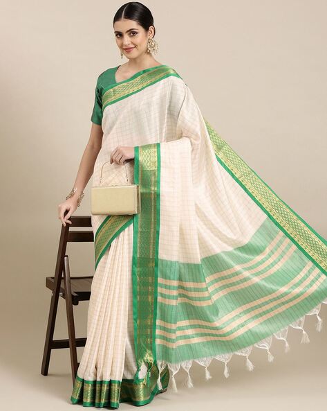 Off white saree with green outlet border