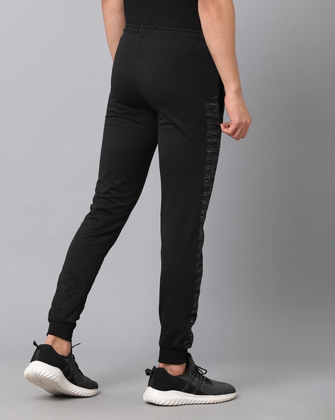women solid mid rise track pants