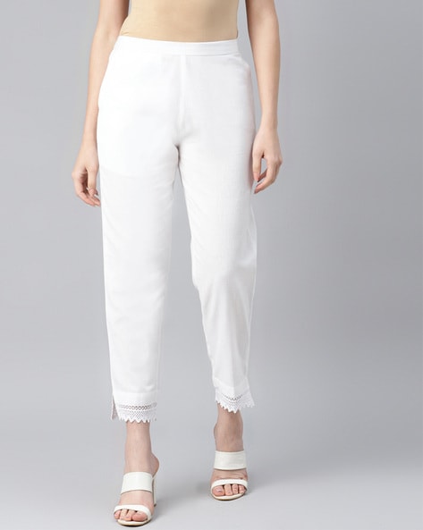 Buy Online Women White Solid Regular Trousers at best price  Plussin