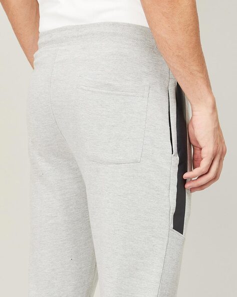 Grey joggers best sale with white string