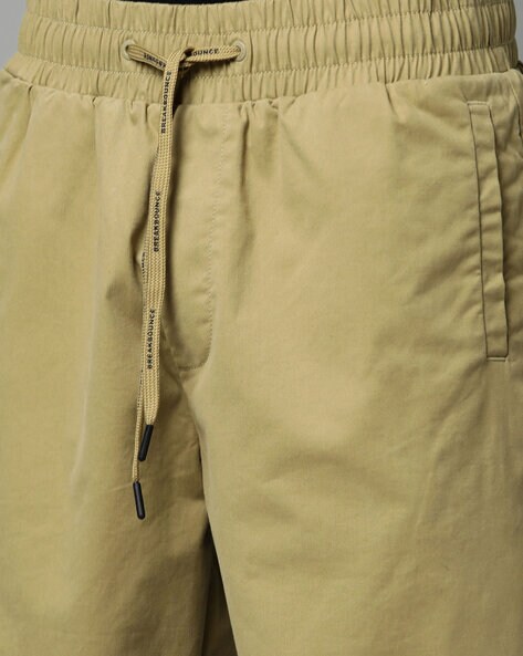 Buy Khaki Trousers & Pants for Men by BREAKBOUNCE Online