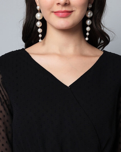 Black dress with pearls hotsell on neckline