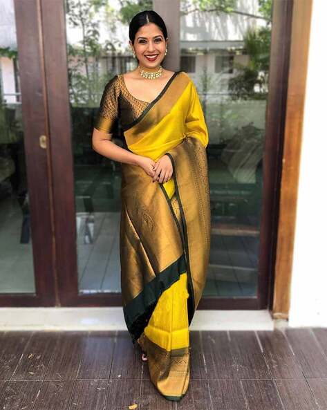 Yellow linen saree with silver border and buttas