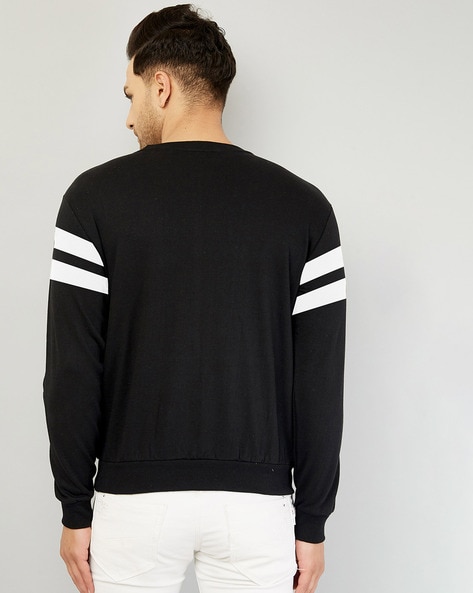 Black sweatshirt with 2025 white stripes on sleeves