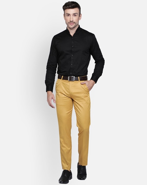 Man Wearing Yellow Shirt and Black Pants · Free Stock Photo