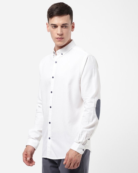 white shirt with elbow patches