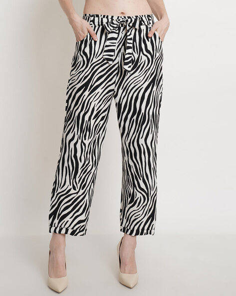 Petite beige animal print flare trousers | River Island