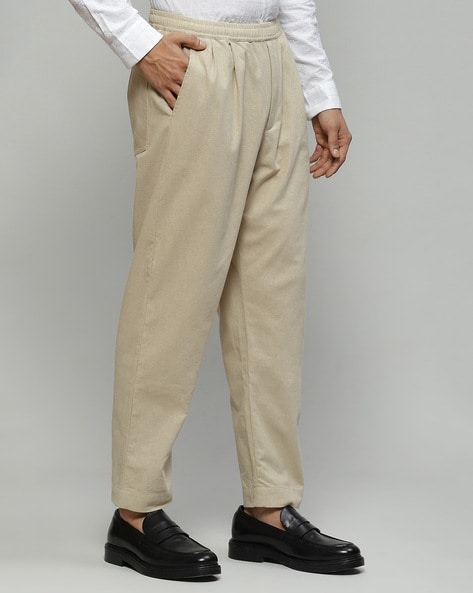 Buy Abraham & Thakore Pleated Cotton Pants | Beige Color Men | AJIO LUXE