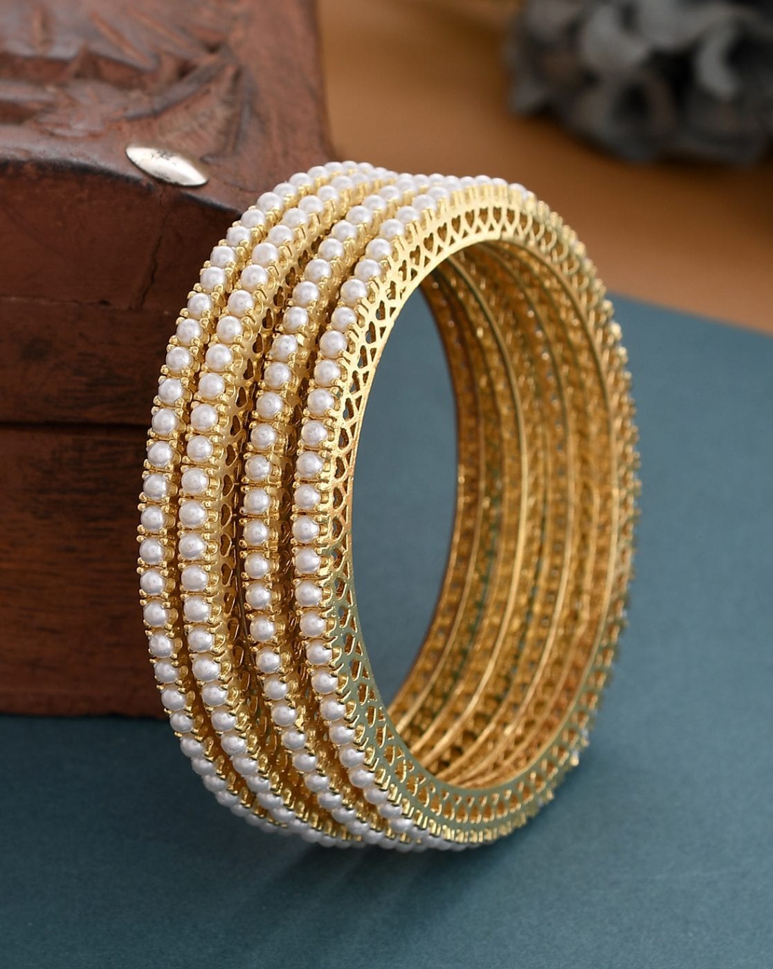 Gold pearl deals bangles designs