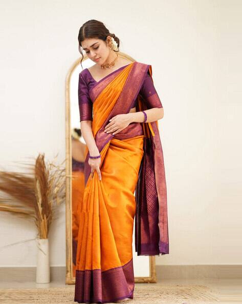 orange saree with violet blouse