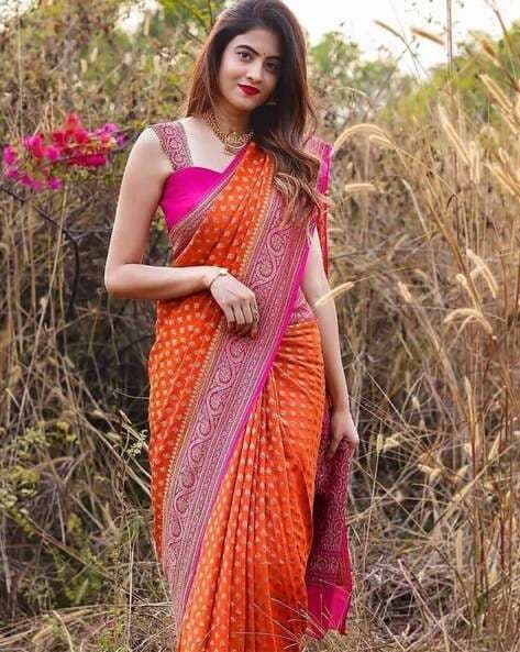 Image of Indian traditional Beautiful Woman Wearing an traditional Saree  And Posing On The Outdoor With a Smile Face-UD842547-Picxy