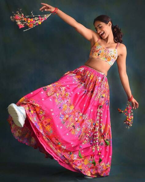 Girl dancing in a red traditional lehenga on Craiyon