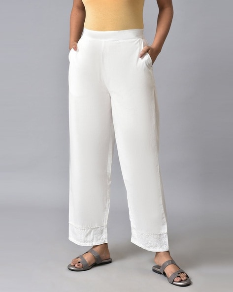 Buy online Women Mid Rise Beige Solid Flat Front Trousers from bottom wear  for Women by Aurelia for ₹1049 at 0% off | 2024 Limeroad.com