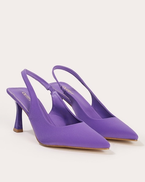 Shoe high heels with haute couture design, purple and black color with gold  curved motifs, front side view on Craiyon
