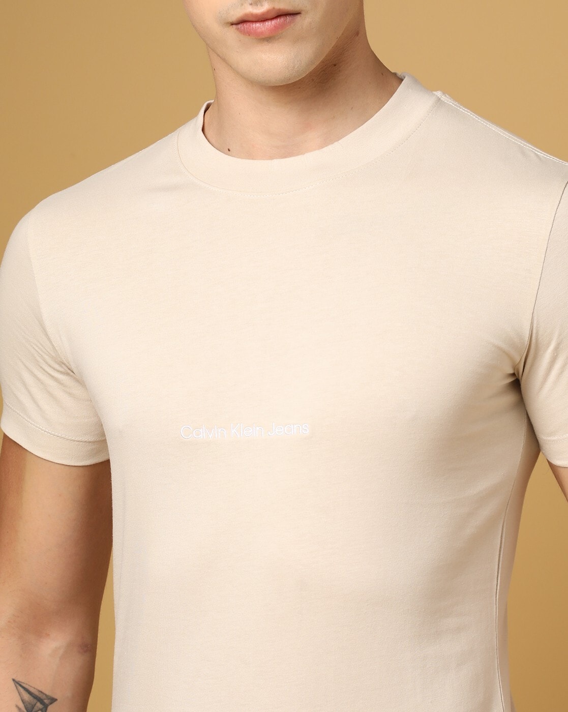 Buy Beige Tshirts for Men by Calvin Klein Jeans Online
