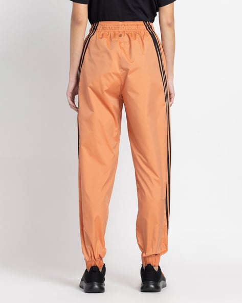 Orange adidas track store pants womens