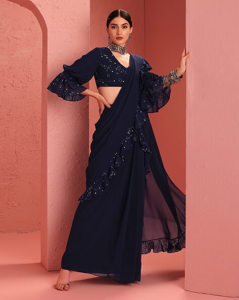 Navy blue ruffled saree with jacket and belt by Ridhi Mehra