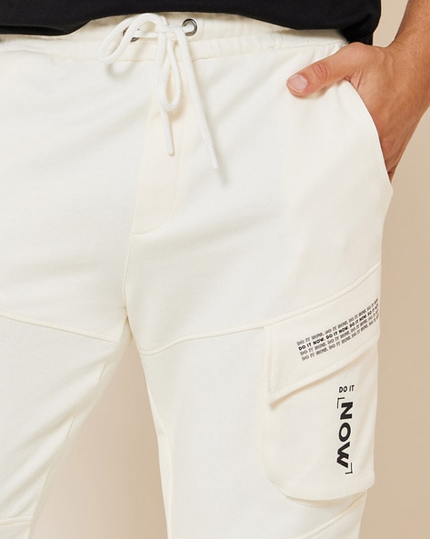 Buy Cream Track Pants for Men by Styli Online