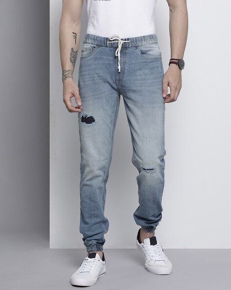 Buy Levi's Levis Men Solid Tapered Fit Mid-Rise Denim Joggers at Redfynd