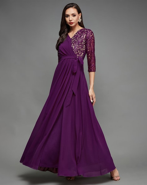 Premium Photo | Beautiful long purple dress on dark baclground
