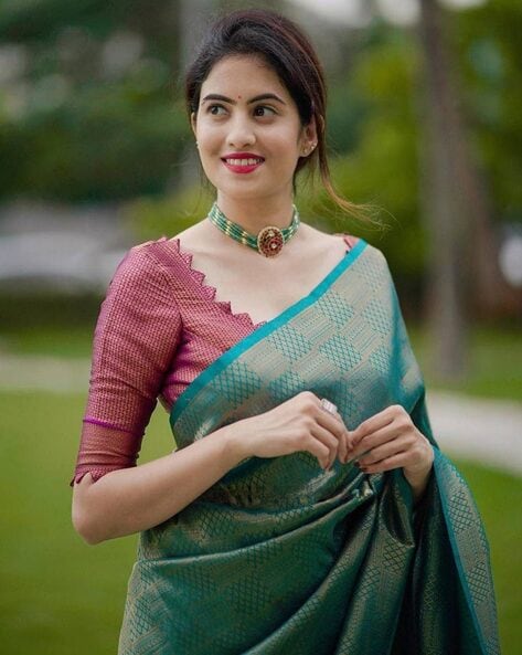 Stylish Indian woman in silk saree and nose ring in a side pose Stock Photo  - Alamy