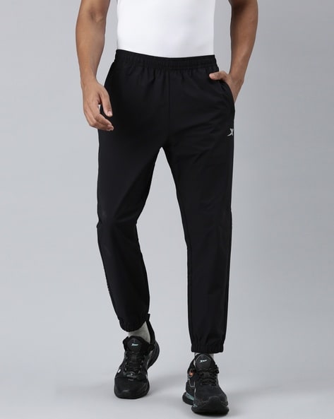 Training Essentials Woven Cuffed Pants in BLACK
