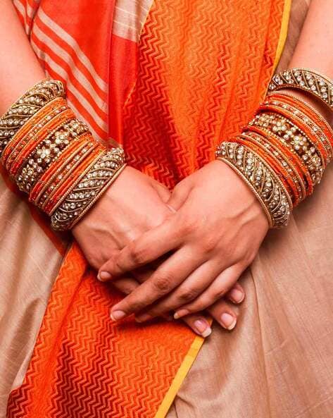 Orange metal deals bangles