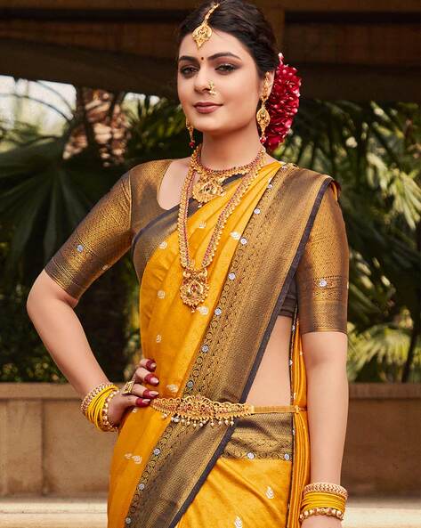 Why do brides wear yellow sarees? - Quora